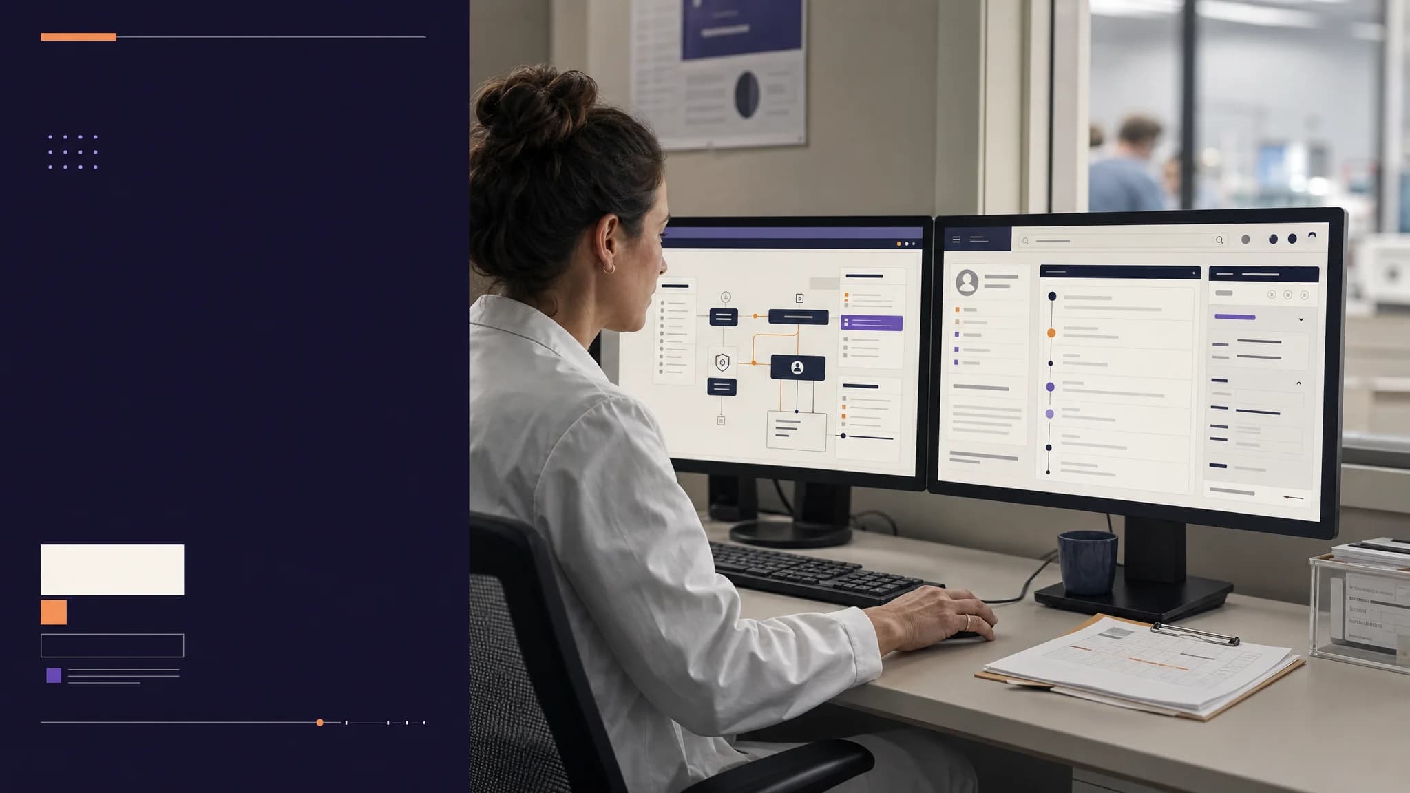 A person in a white lab coat works at dual monitors displaying data and charts in a modern office setting.